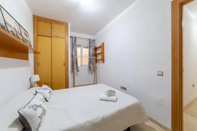 Cama o camas de una habitación en AlmeriaSuite Beach&Sun