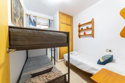 Cama o camas de una habitación en AlmeriaSuite Beach&Sun