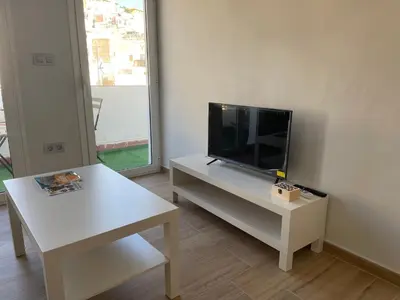 Una televisión o centro de entretenimiento en Apartamento Cine Wifi