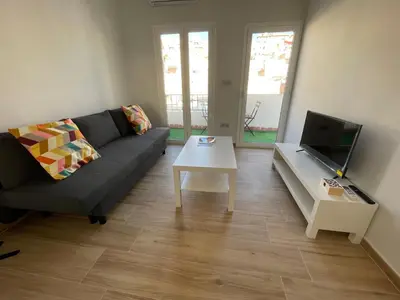 Una televisión o centro de entretenimiento en Apartamento Cine Wifi