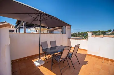 Un balcón o terraza de Atico Junto al Mar Jardines de Nuevo Vera Acceso directo a la playa WIFI