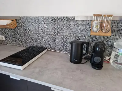 Una cocina o zona de cocina en Casa De La Familia - Appartement