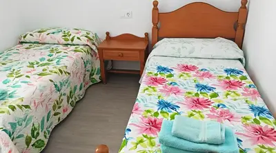 Cama o camas de una habitación en Apartamento reformado con piscina y vistas