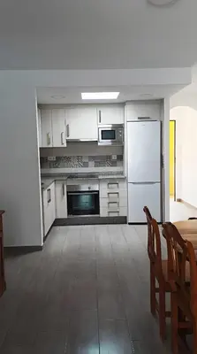 Una cocina o zona de cocina en Apartamento reformado con piscina y vistas