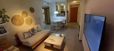 Una televisión o centro de entretenimiento en Apartamento El Zapillo II
