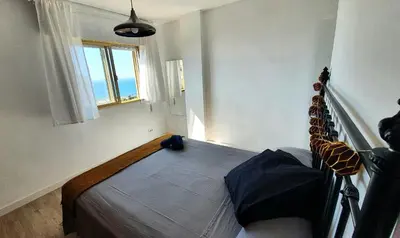 Cama o camas de una habitación en PALM TOWER APARTMENT