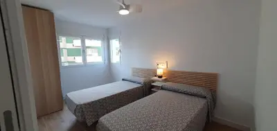 Cama o camas de una habitación en Balcón Playa Delicias