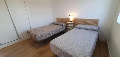 Cama o camas de una habitación en Balcón Playa Delicias