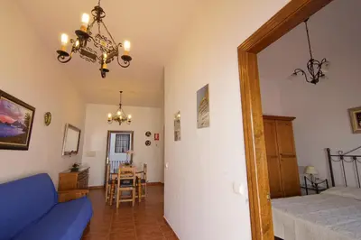 Cama o camas de una habitación en La Posada De Carmen