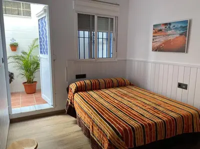 Cama o camas de una habitación en Apartamento a pie de playa