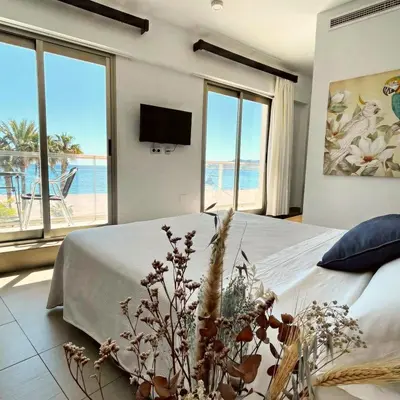 Cama o camas de una habitación en Hotel Alboran