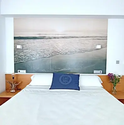 Cama o camas de una habitación en Hotel Alboran