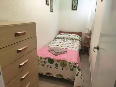 Cama o camas de una habitación en Rinconcito, AA, wifi, a pie de mar