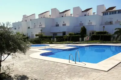 Piscina en o cerca de Adosado en playa Vera,3 piscinas
