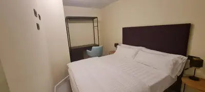 Cama o camas de una habitación en BYS SANTA FE APARTAMENTOS TURISTICOS