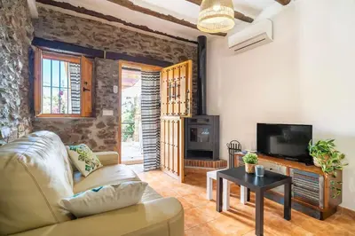 Una televisión o centro de entretenimiento en Paraje la Suerte Apartamento Dalia