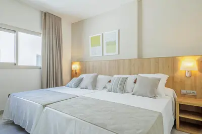 Cama o camas de una habitación en Apartamentos Turísticos Best Indalo