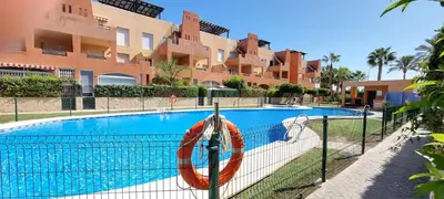 Piscina en o cerca de Homes of Spain, Apartamentos Paraiso Vera Playa, Ed Tahiti, Atico E de 2 dormitorios con piscina privada en solárium y barbacoa, pie de playa, WIFI