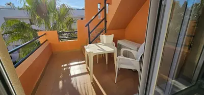 Un balcón o terraza de Homes of Spain, Apartamentos Paraiso Vera Playa, Ed Tahiti, Atico B de 2 dormitorios con piscina privada en solárium y barbacoa, pie de playa
