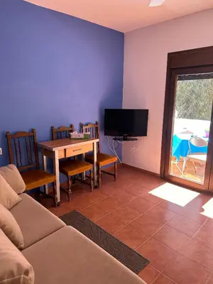 Una televisión o centro de entretenimiento en Casa El Sotillo