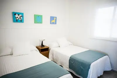 Cama o camas de una habitación en Bonito apartamento ideal para familias con piscina en Roquetas