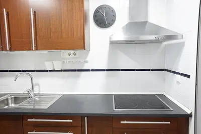 Una cocina o zona de cocina en Bonito apartamento ideal para familias con piscina en Roquetas