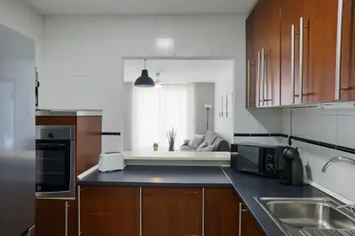 Una cocina o zona de cocina en Bonito apartamento ideal para familias con piscina en Roquetas