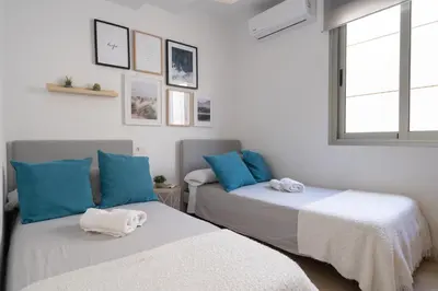 Cama o camas de una habitación en Apartamento Cervantes con terraza y vistas al mar