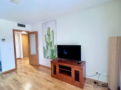 Una televisión o centro de entretenimiento en Apartamento Arcos Costa Cálida III