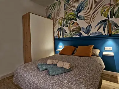 Cama o camas de una habitación en Elegante apartamento de diseño.