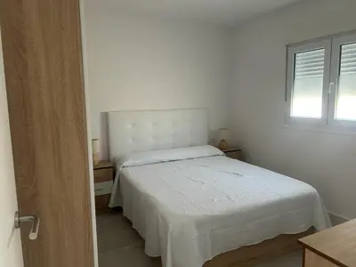 Cama o camas de una habitación en Apartamentos MILANO