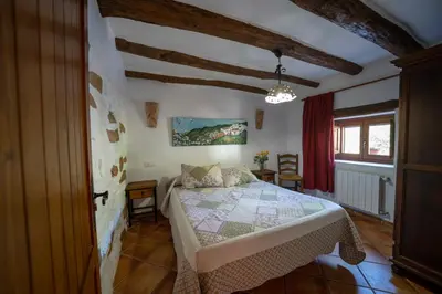 Cama o camas de una habitación en farmhouse la Curiosa