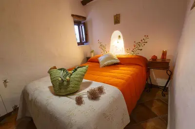 Cama o camas de una habitación en farmhouse la Curiosa