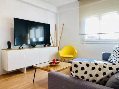 Una televisión o centro de entretenimiento en Apartamento HC13 - PUERTA PURCHENA