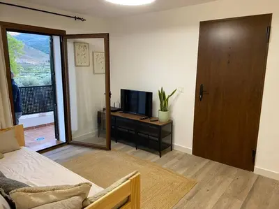 Una televisión o centro de entretenimiento en Apartamento Laujar de Andarax
