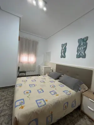 Cama o camas de una habitación en Bonito apartamento cerca de la playa