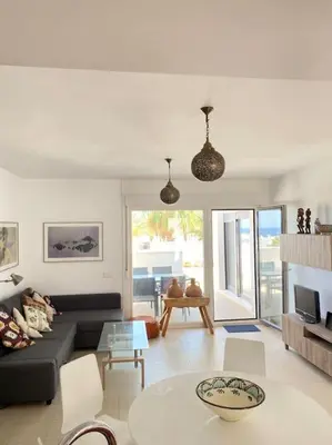 Zona de estar de Villa Hélice - Apartamento con piscina, terraza y pádel en Cabo de Gata