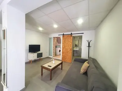 Una televisión o centro de entretenimiento en Casa en el Centro con vistas - by Aloha Palma