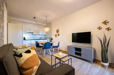 Una televisión o centro de entretenimiento en Bajo con terraza #Playa 8min #Chill out #Cuna