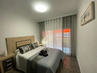 Cama o camas de una habitación en Apartamento Las Gaviotas Aguadulce con Piscina y Jardin