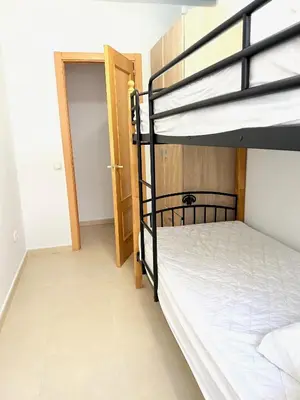 Cama o camas de una habitación en Lago De Almerimar Three Bedroom Beach Front Apartment
