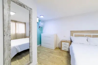 Cama o camas de una habitación en AlmeriaSuite Mojacar Playa