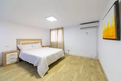 Cama o camas de una habitación en AlmeriaSuite Mojacar Playa