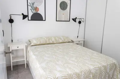 Cama o camas de una habitación en Bajo con patio, Calle Cañada Aguilar 10