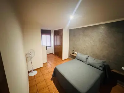 Cama o camas de una habitación en A pie de playa