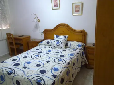 Cama o camas de una habitación en Hostal Asensio Nijar