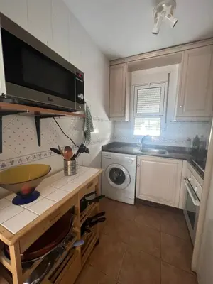 Una cocina o zona de cocina en Golf & Beach Apartment