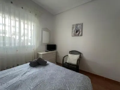 Cama o camas de una habitación en Golf & Beach Apartment
