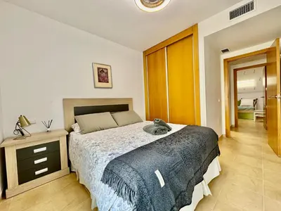 Cama o camas de una habitación en Apartamento con vistas al mar en urbanización de lujo Almerimar