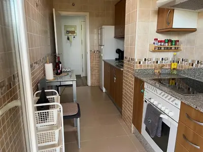 Una cocina o zona de cocina en Acogedor Apartamento